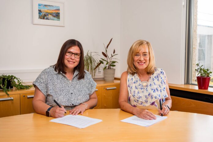 georgina-and-jane-signing-contracts-completion-smiling1